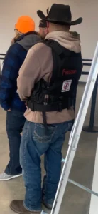 A UCP member wears their bulletproof vest to the AGM